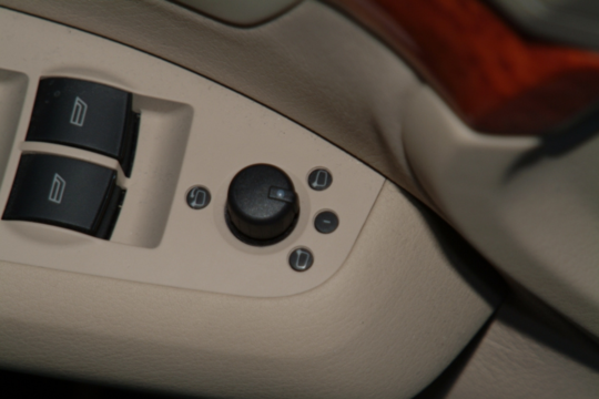 Door panel of a modern passenger car – electrical mirror adjustment